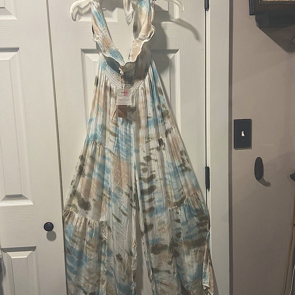 Brand new from Key West, FL. Multi-colored halter part ties behind neck.